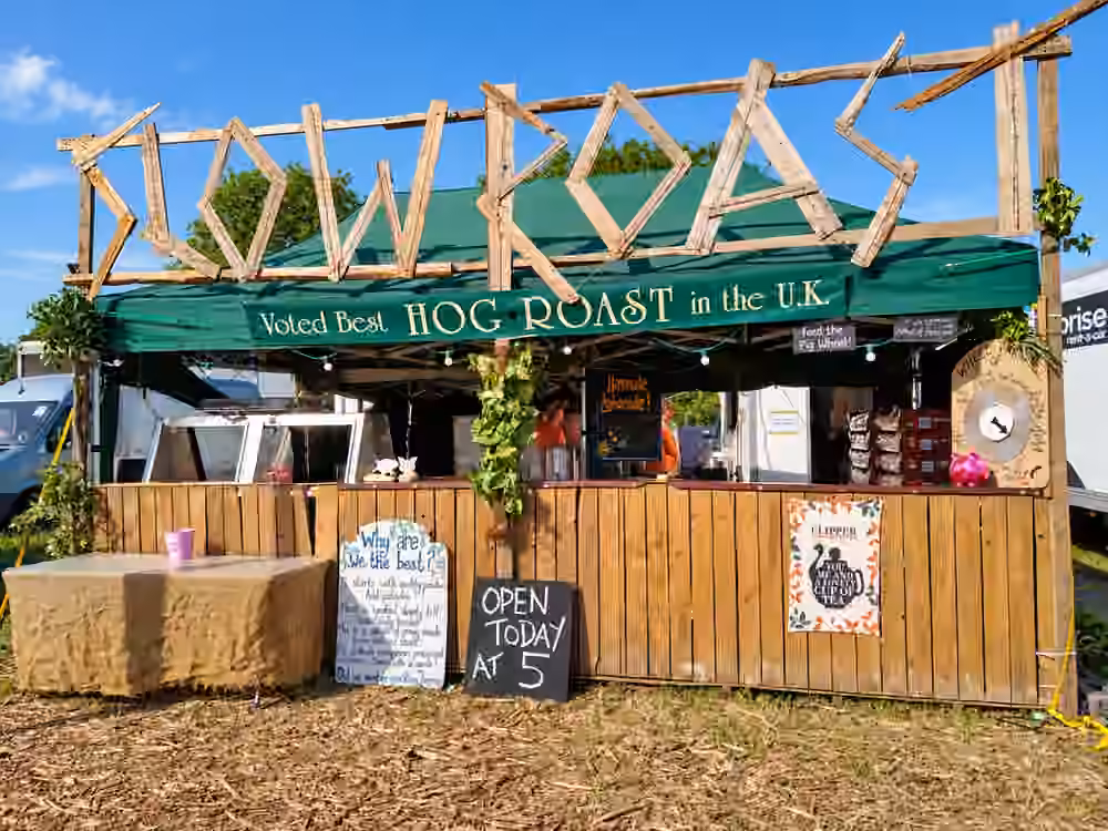 The Slow Roast stall set up in daylight at an outdoor event